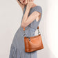 Fashionable shoulder bag with a crocodile print