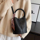 Woven textured leather bucket bag for women